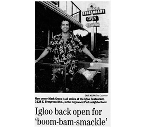 Newspaper clipping shows a smiling man in a Hawaiian shirt leaning his hands on a railing and a table. Behind him is a neon sign that says Igloo Restaurant Open. The headline text says Igloo back for Boom Bam Smackle.